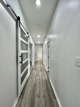 a view of gallery with wooden floor