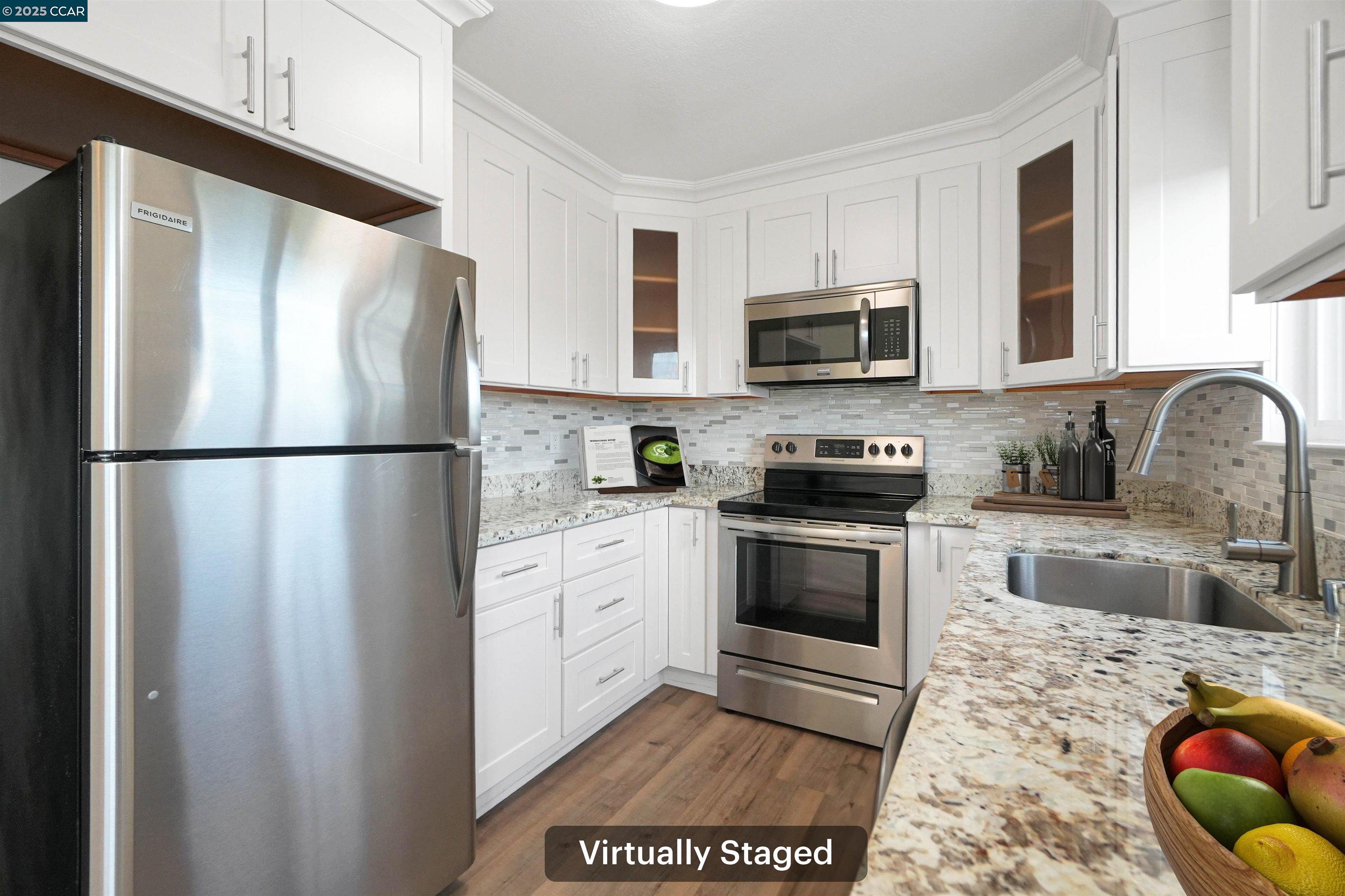 3712 Willow Pass Road, Unit 31 Concord, CA 94519 - Photo 4 of 17 a kitchen with granite countertop a refrigerator stove top oven a sink and dishwasher