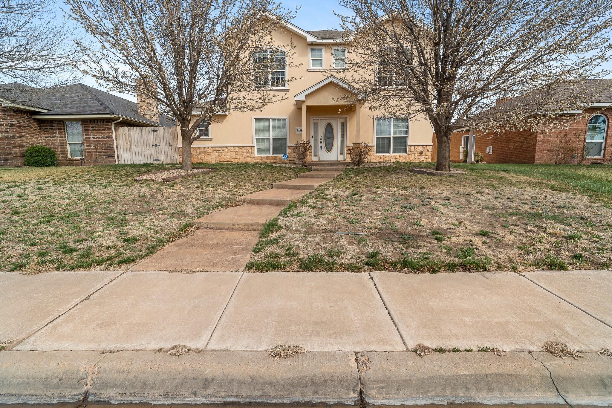front view of a house with a yard