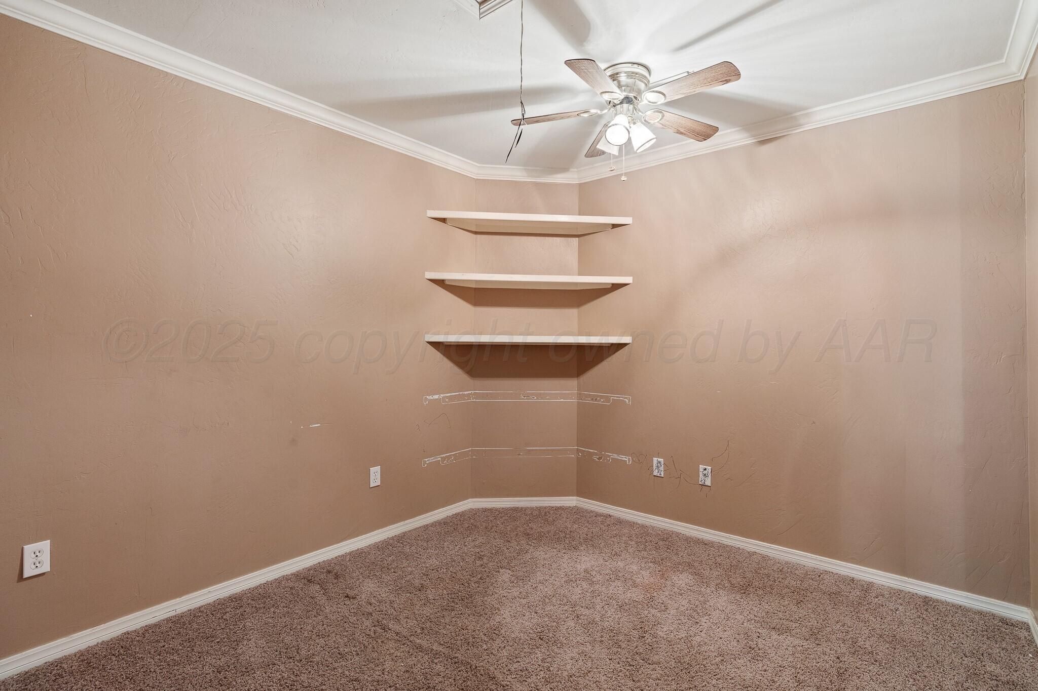 6302 Academy Drive Amarillo, TX 79119 - Photo 11 of 19 an empty room with a chandelier fan