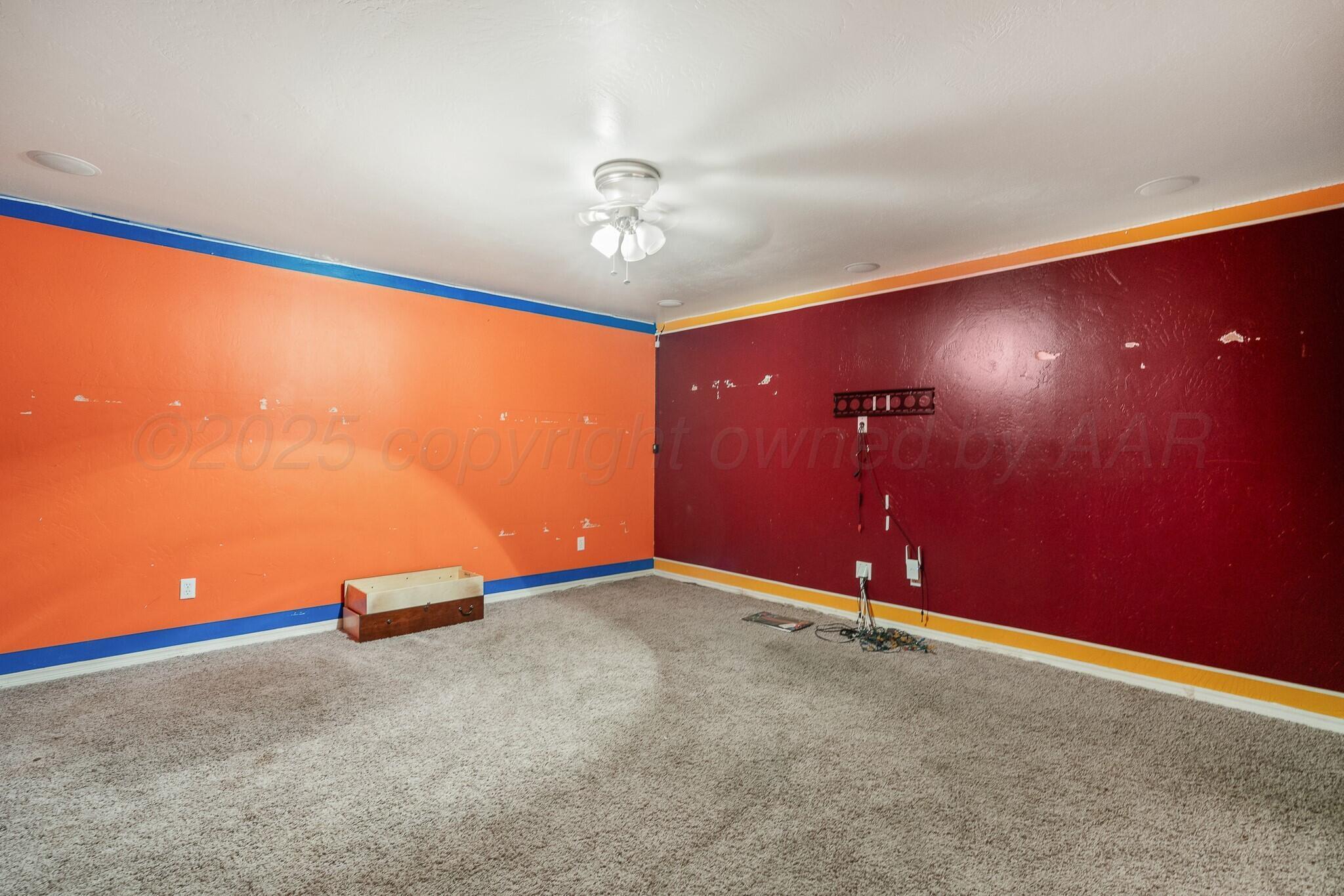 6302 Academy Drive Amarillo, TX 79119 - Photo 13 of 19 an empty room with projector and furniture