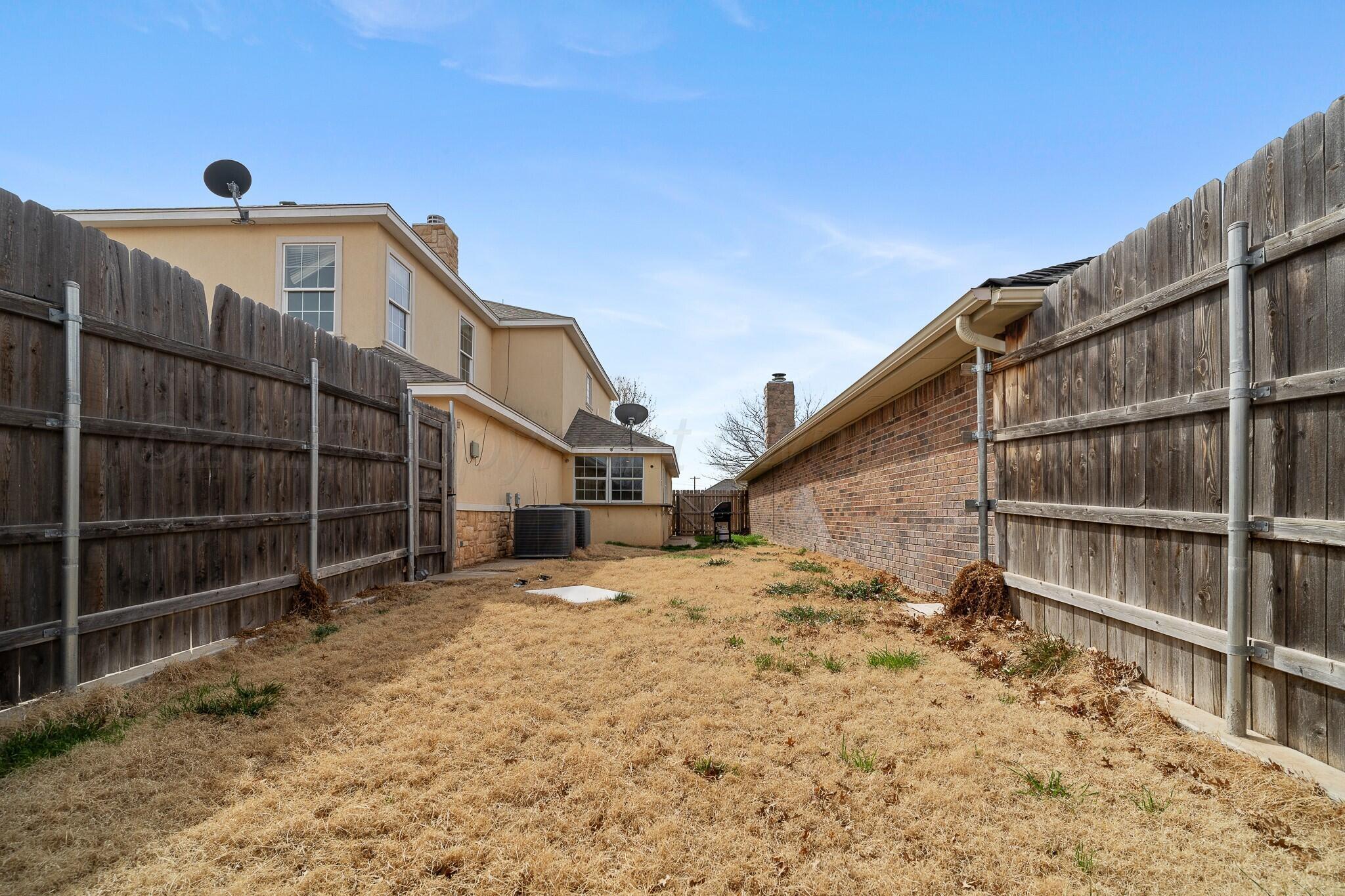 6302 Academy Drive Amarillo, TX 79119 - Photo 18 of 19 a view of a house with a snow on the wall