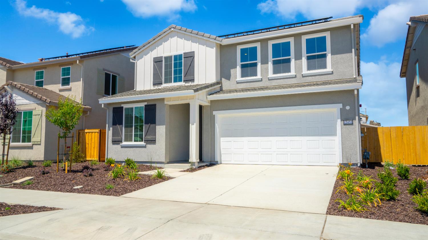 15451 Gallatin Road Lathrop, CA 95330 - Photo 1 of 1 a front view of a house with a garden