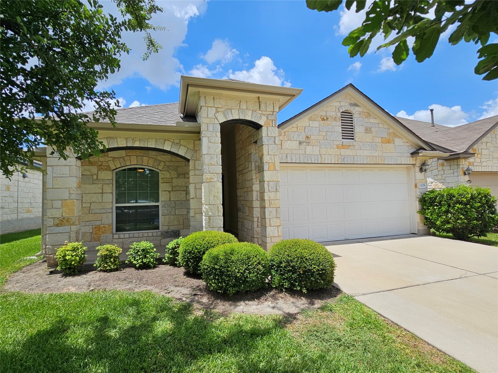 13708 Loleta Way Austin, TX 78717 - Photo 1 of 1 a front view of a house with a yard