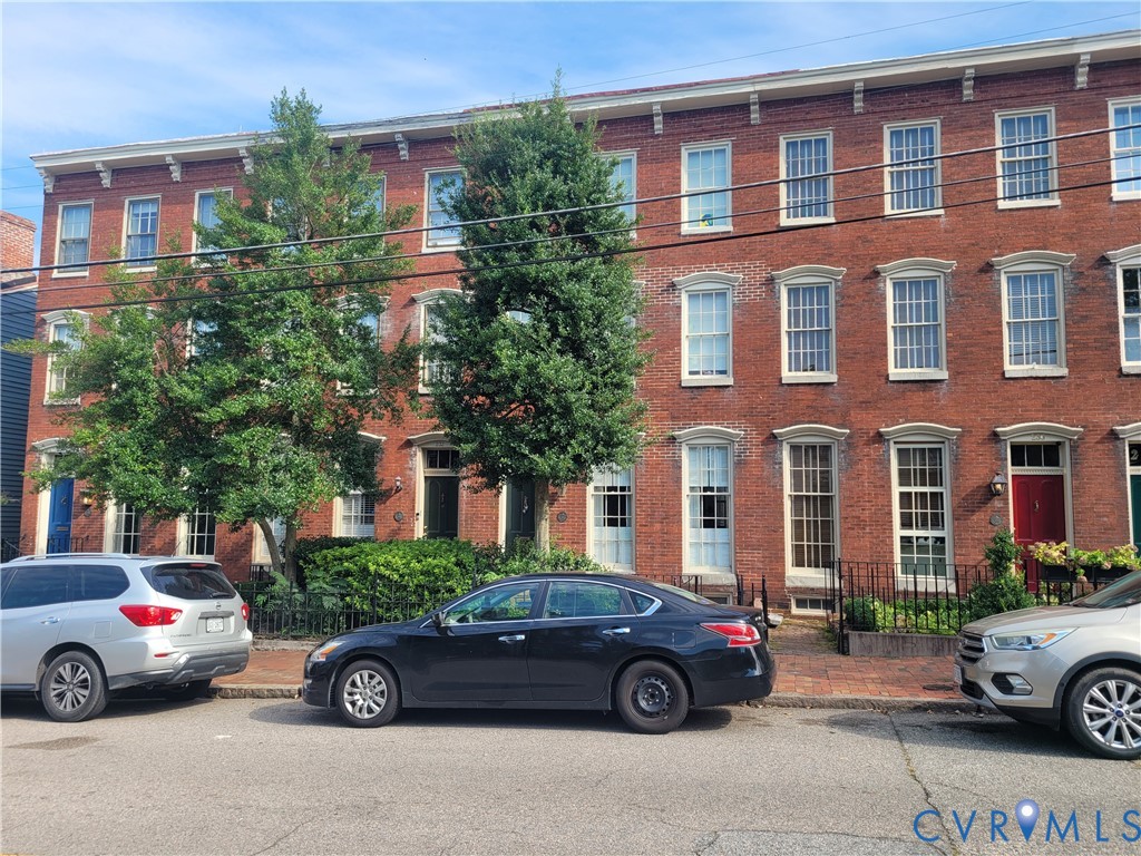 a front view of a house with parking space