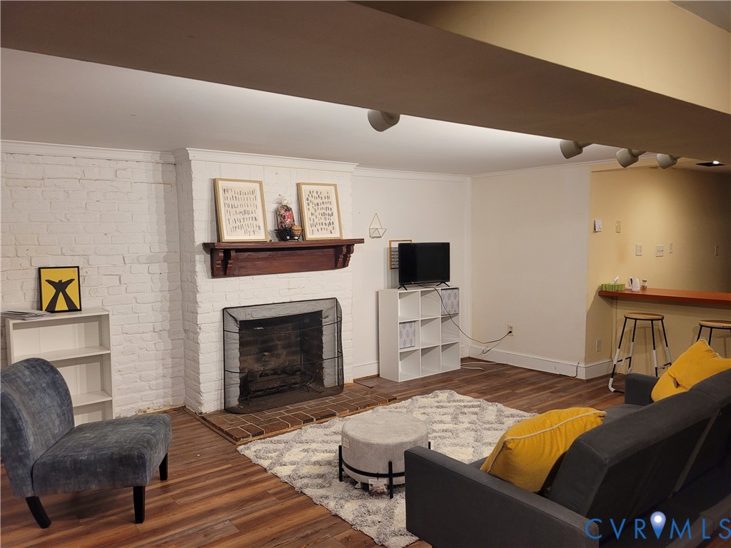 232 High Street, Unit B Petersburg, VA 23803 - Photo 2 of 7 a bedroom with furniture and a fireplace