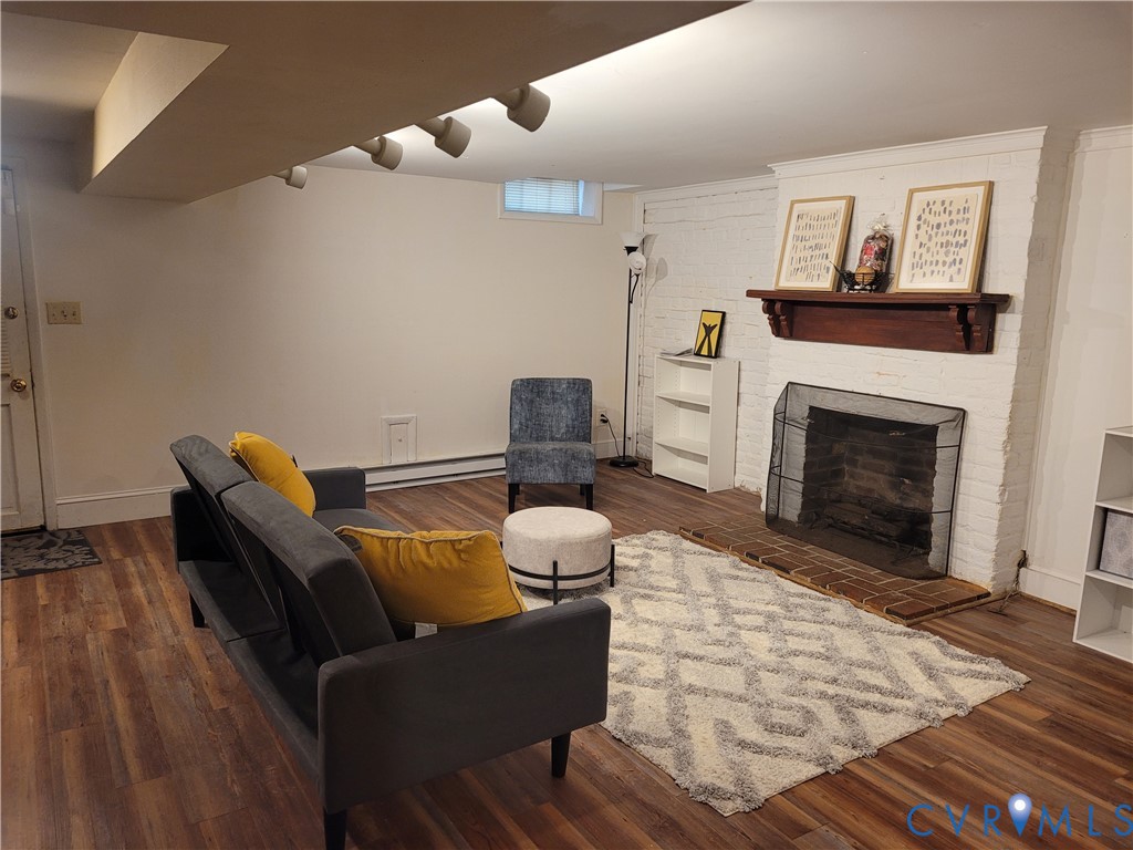 232 High Street, Unit B Petersburg, VA 23803 - Photo 3 of 7 a living room with furniture and a fireplace