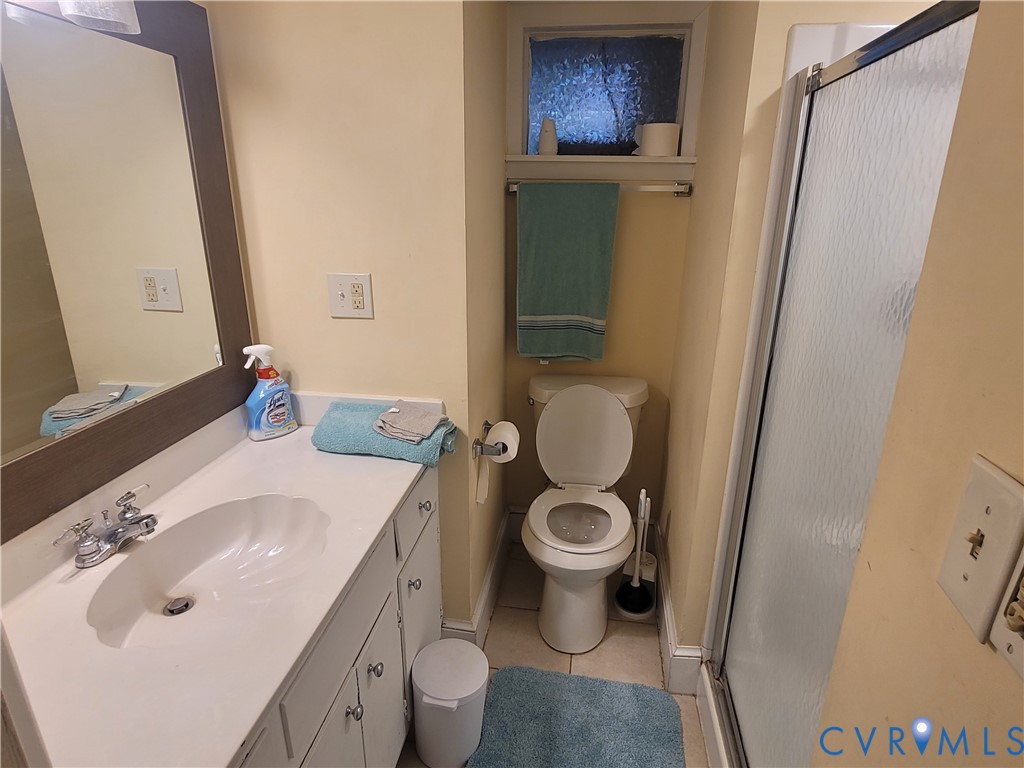 232 High Street, Unit B Petersburg, VA 23803 - Photo 6 of 7 a bathroom with a sink and a mirror