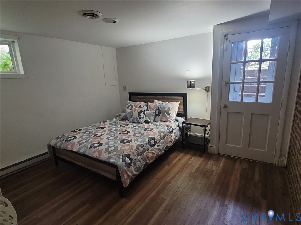 232 High Street, Unit B Petersburg, VA 23803 - Photo 7 of 7 a bed sitting in a bedroom next to a window