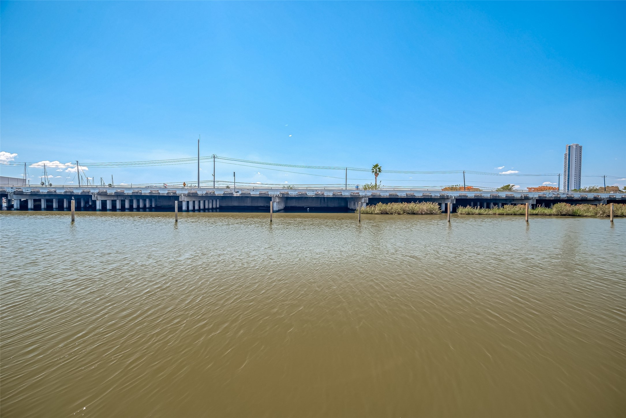 43 Commander Runco Lane Seabrook, TX 77586 - Photo 10 of 21 a view of a ocean with boats and trees in the background