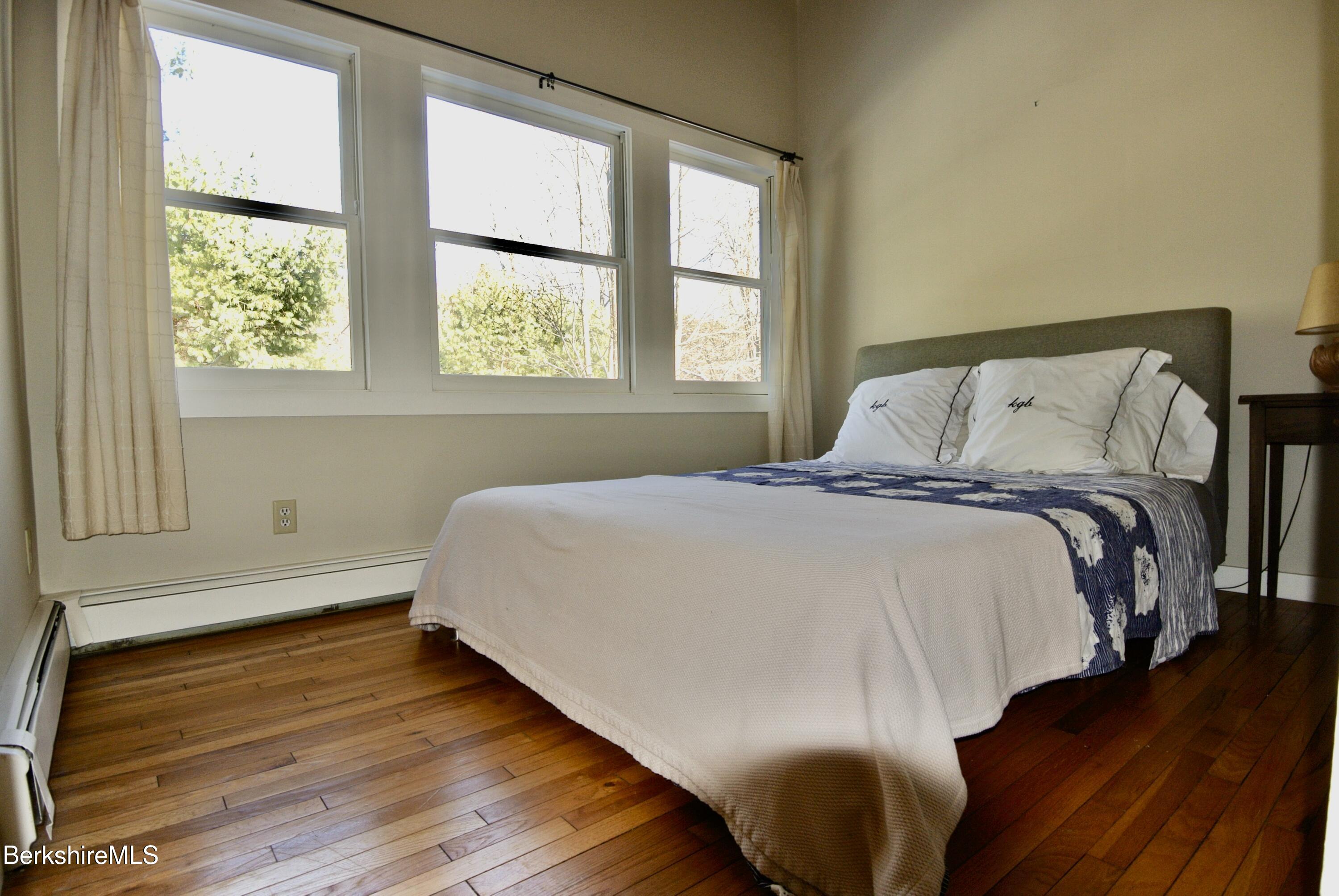 9 Cone Hill Road West Stockbridge, MA 01266 - Photo 17 of 20 a bedroom with a bed and wooden floor