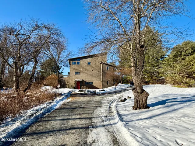a park view with wooden fence and trees