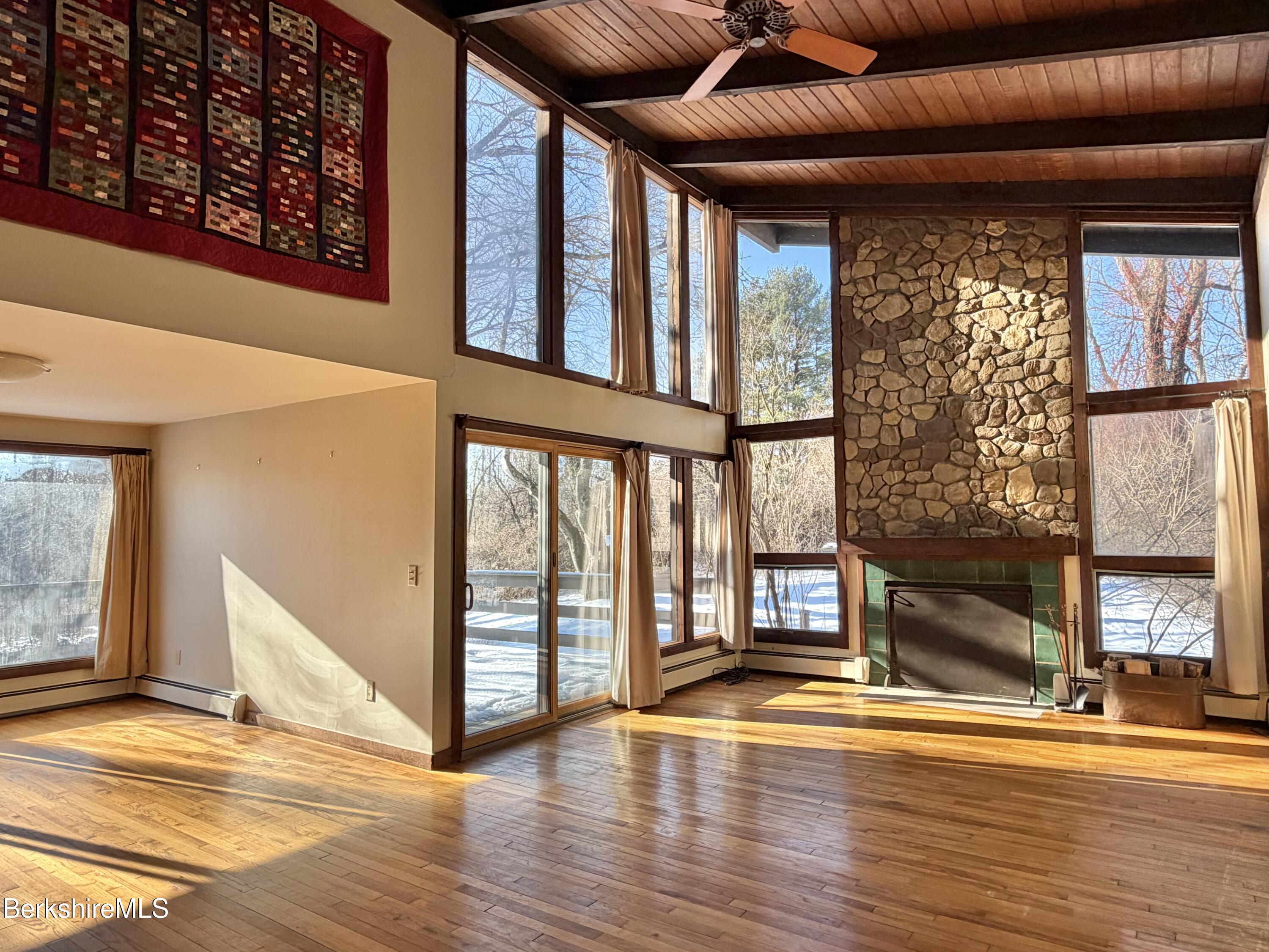 9 Cone Hill Road West Stockbridge, MA 01266 - Photo 8 of 20 a view of an empty room with wooden floor and a window