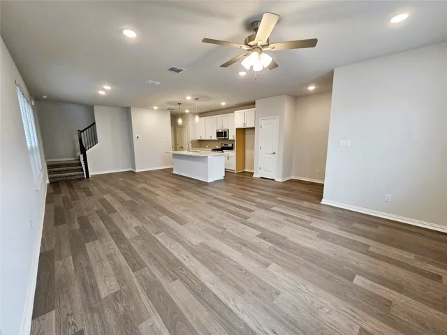 a view of a kitchen with a sink and a stove