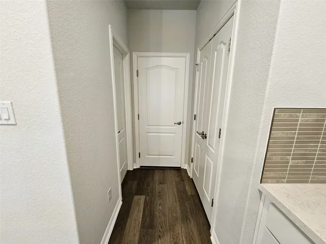 a kitchen with stainless steel appliances a sink a stove top oven a counter space and cabinets