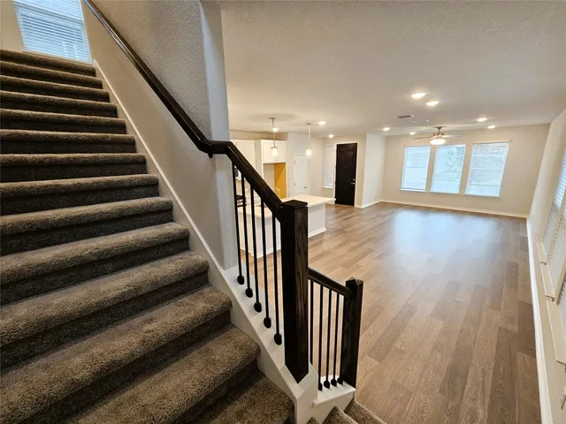 a white toilet sitting next to a bathroom sink