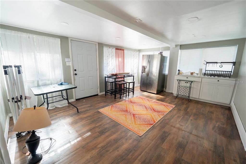 535 West Division Street Deland, FL 32720 - Photo 12 of 25 a room with lots of furniture and wooden floor