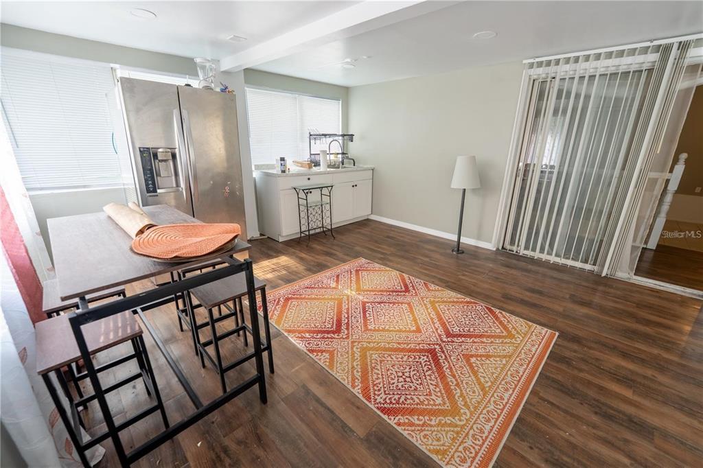535 West Division Street Deland, FL 32720 - Photo 13 of 25 a living room with furniture and a wooden floor