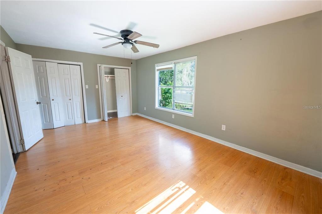 535 West Division Street Deland, FL 32720 - Photo 14 of 25 wooden floor in an empty room with a window
