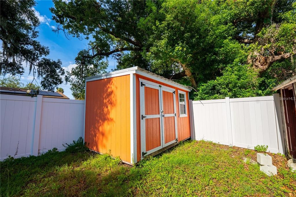 535 West Division Street Deland, FL 32720 - Photo 22 of 25 a view of backyard with tub and plants