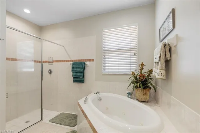 a white bath tub sitting next to a white sink
