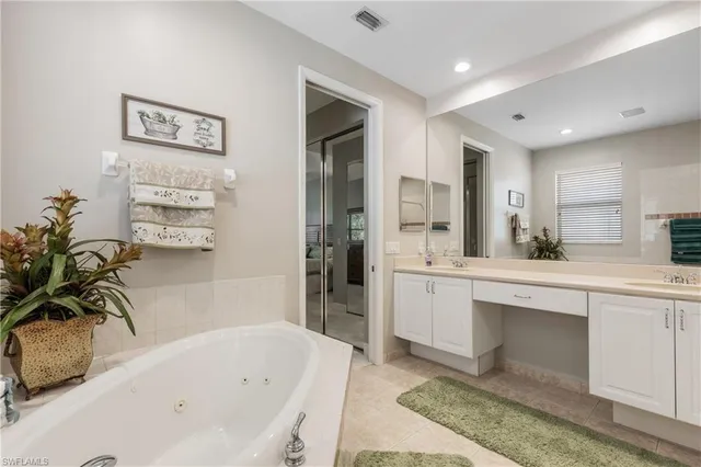 a bathroom with a bathtub and a sink