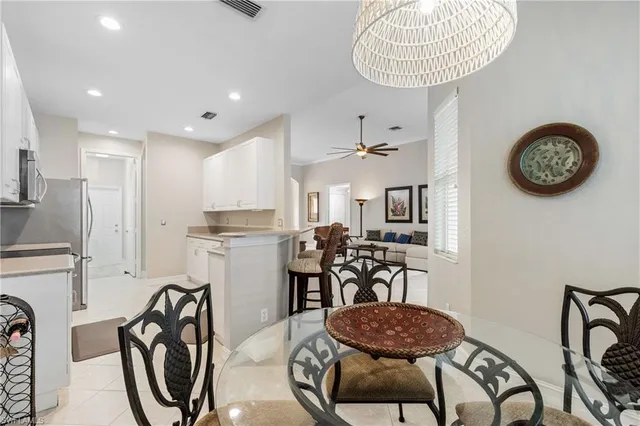 a view of a dining room with furniture window and chandelier