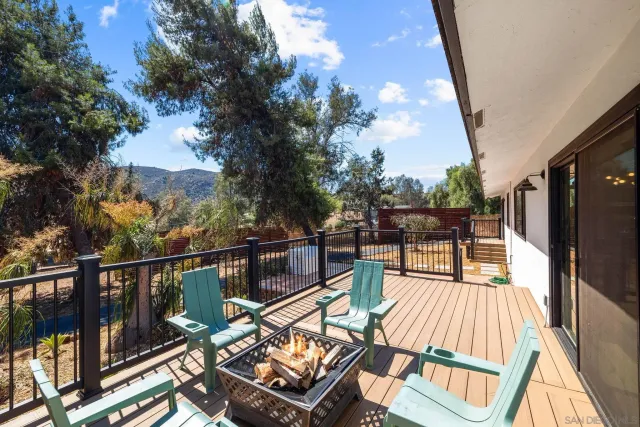 a kitchen with stainless steel appliances granite countertop wooden cabinets a sink and a stove