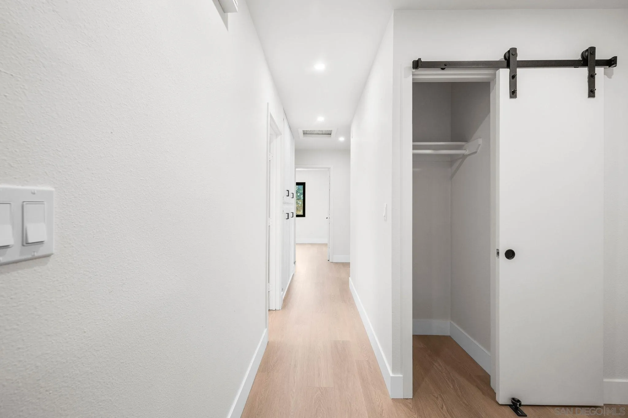 15277 Oak Creek Road El Cajon, CA 92021 - Photo 22 of 71 a view of a hallway with wooden floor