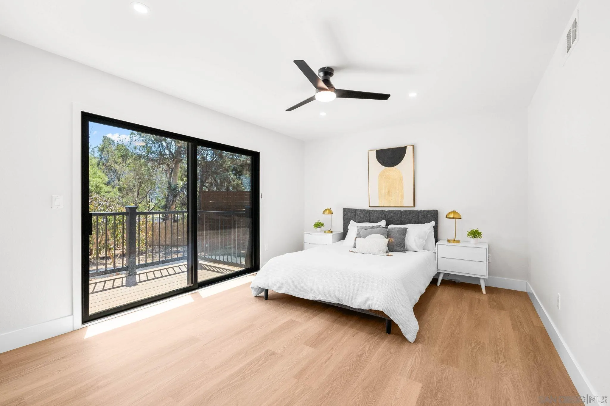 15277 Oak Creek Road El Cajon, CA 92021 - Photo 23 of 71 a bedroom with a bed and large window