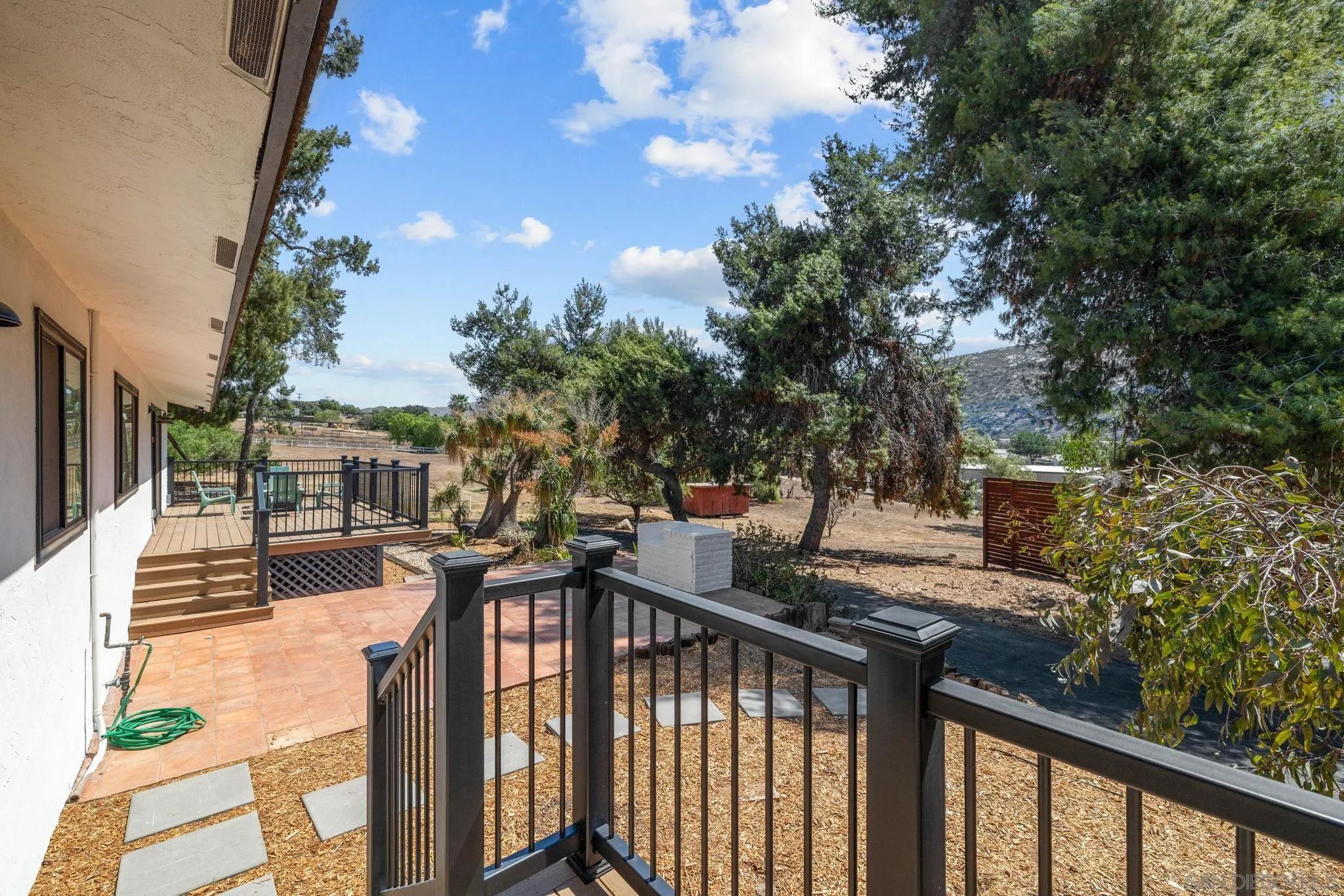 15277 Oak Creek Road El Cajon, CA 92021 - Photo 26 of 71 a view of a house with backyard and sitting area