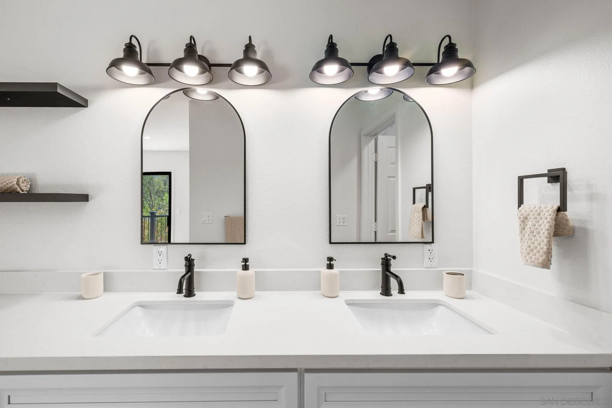 15277 Oak Creek Road El Cajon, CA 92021 - Photo 28 of 71 a bathroom with double vanity sinks and two mirror