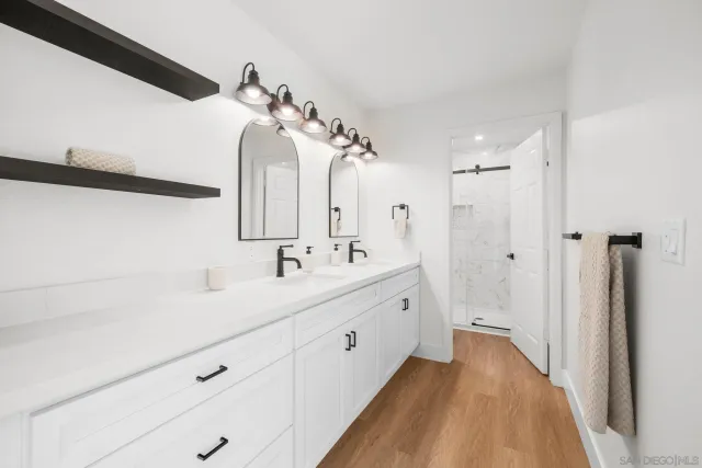 a white bath tub sitting next to a white toilet