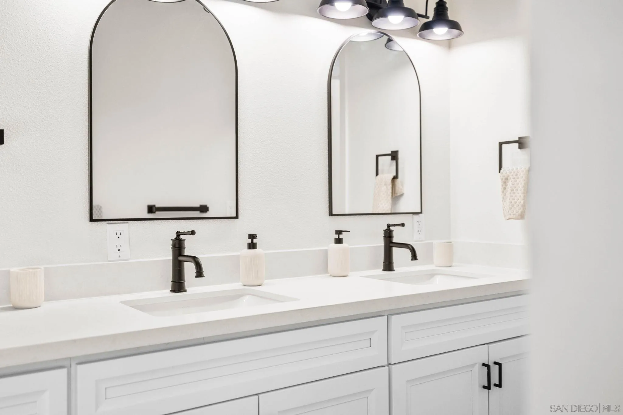 15277 Oak Creek Road El Cajon, CA 92021 - Photo 30 of 71 a bathroom with a double vanity sink and a mirror