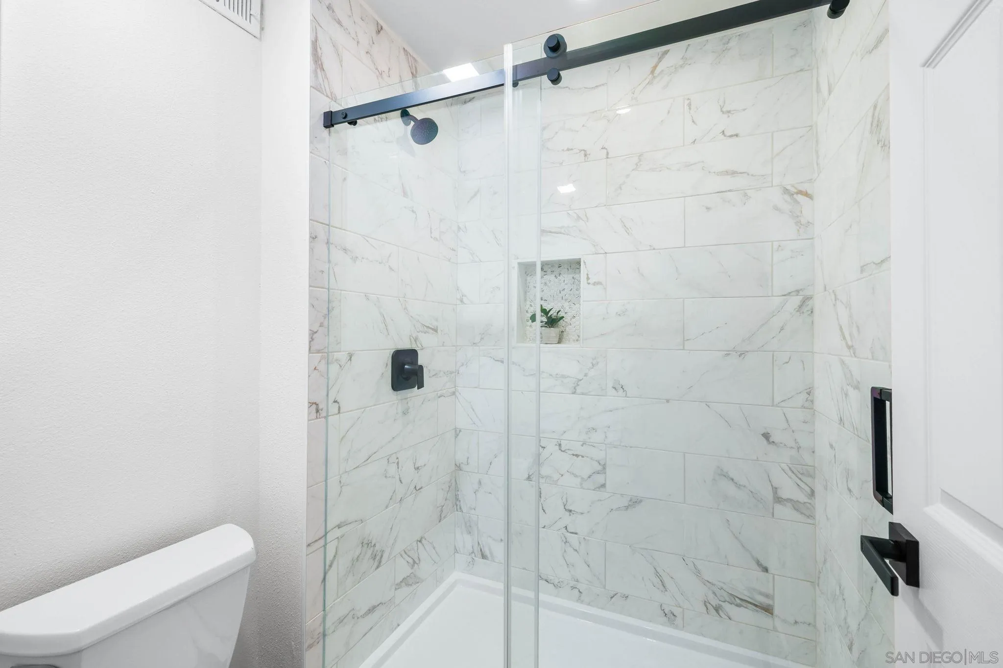 15277 Oak Creek Road El Cajon, CA 92021 - Photo 31 of 71 a bathroom with a shower and a toilet