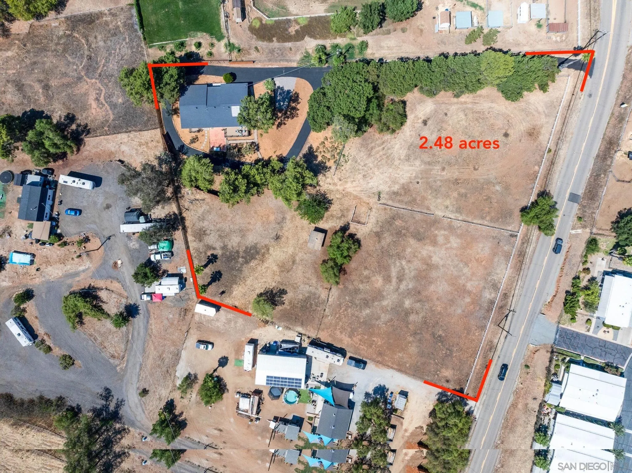 15277 Oak Creek Road El Cajon, CA 92021 - Photo 51 of 71 an aerial view of a house with a yard and garden