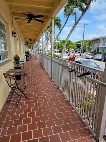 a view of a chairs and table in the balcony