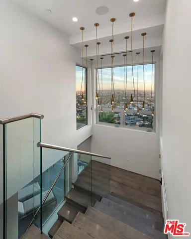 a large bedroom with a large bed and a large window