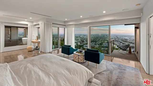 a bathroom with a large tub and shower