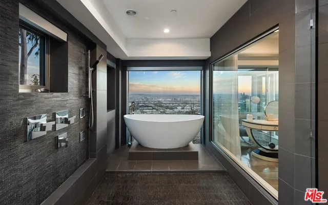 a lobby with furniture and a floor to ceiling window