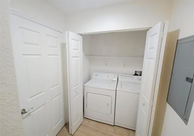 a utility room with dryer and washer