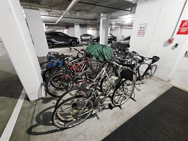 a view of a tall building next to a road