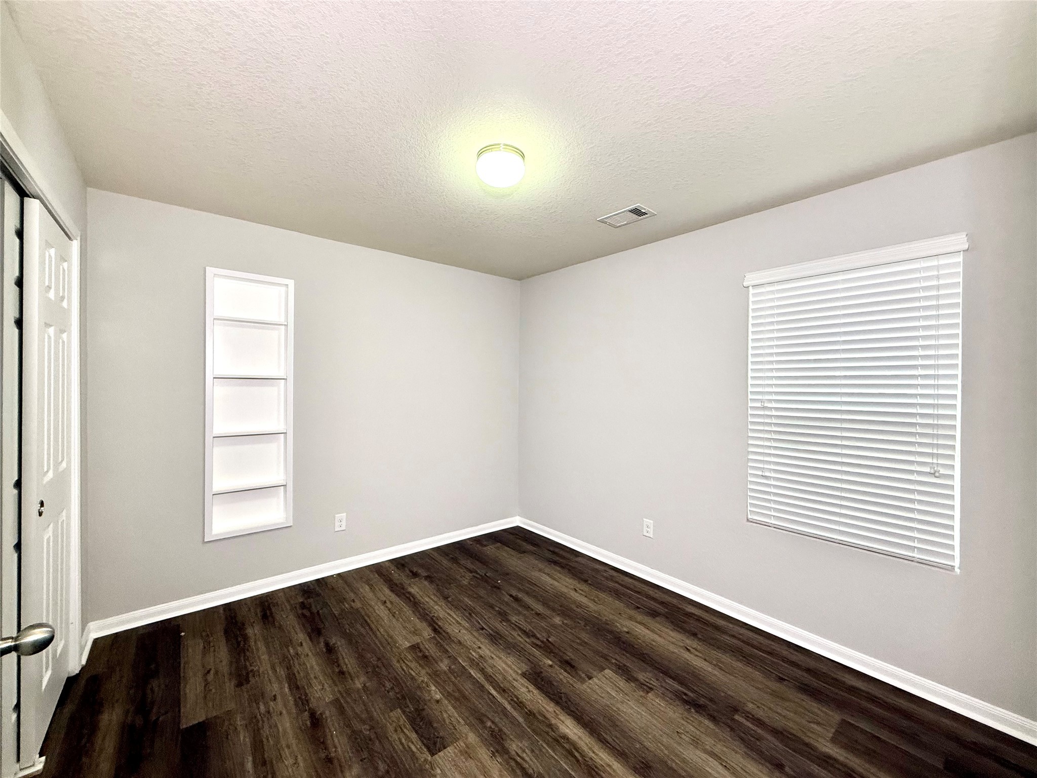 10646 Chestnut Path Way Tomball, TX 77375 - Photo 17 of 22 a view of a room with wooden floor and windows