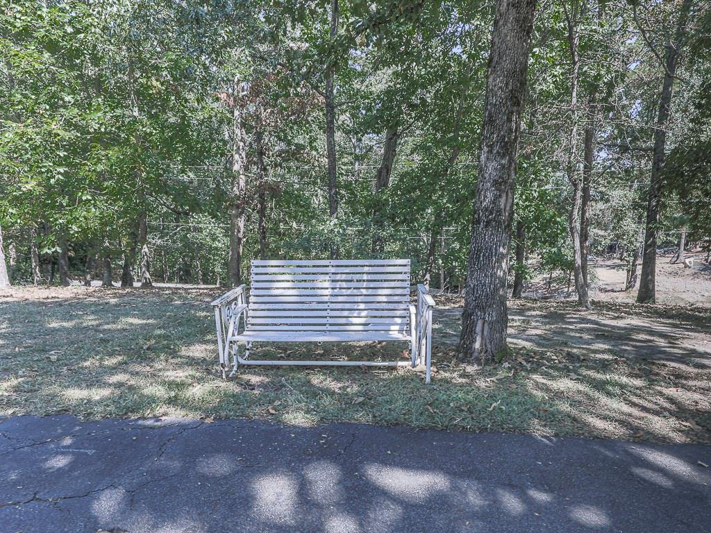 633 Butterworth Road Canton, GA 30114 - Photo 48 of 55 a view of a house with a yard