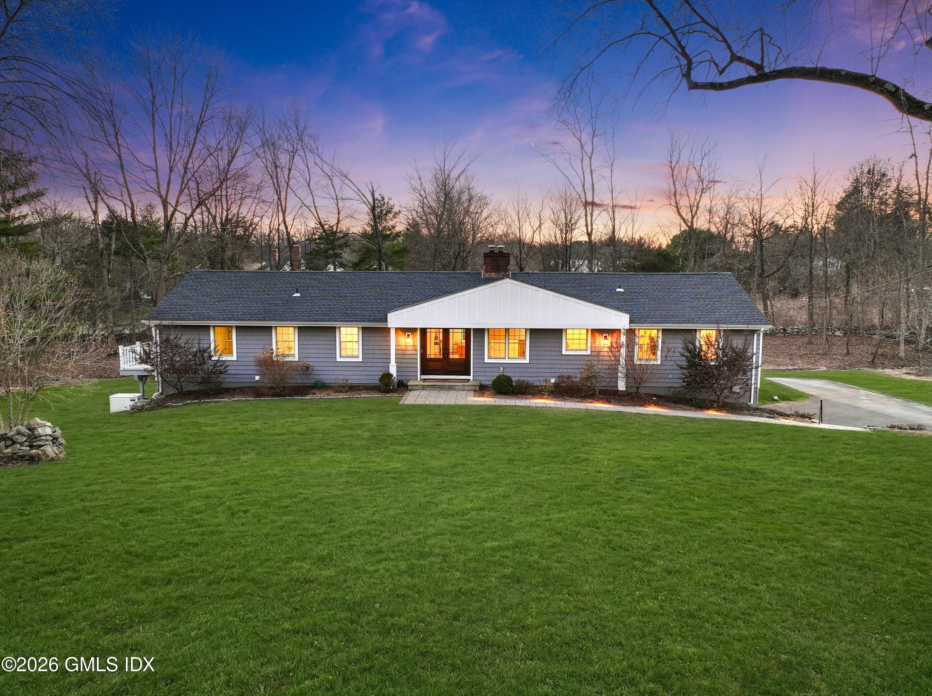 97 Davenport Ridge Lane Stamford, CT 06903 - Photo 2 of 31 a front view of a house with yard and green space