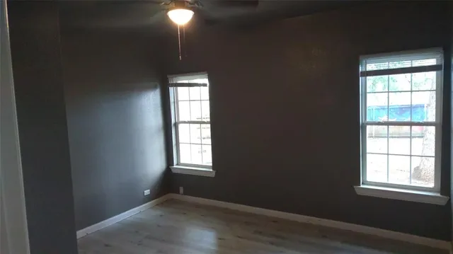 an empty room that has a window