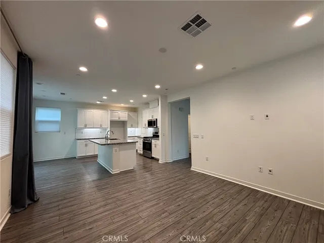 a view of a kitchen and dining room