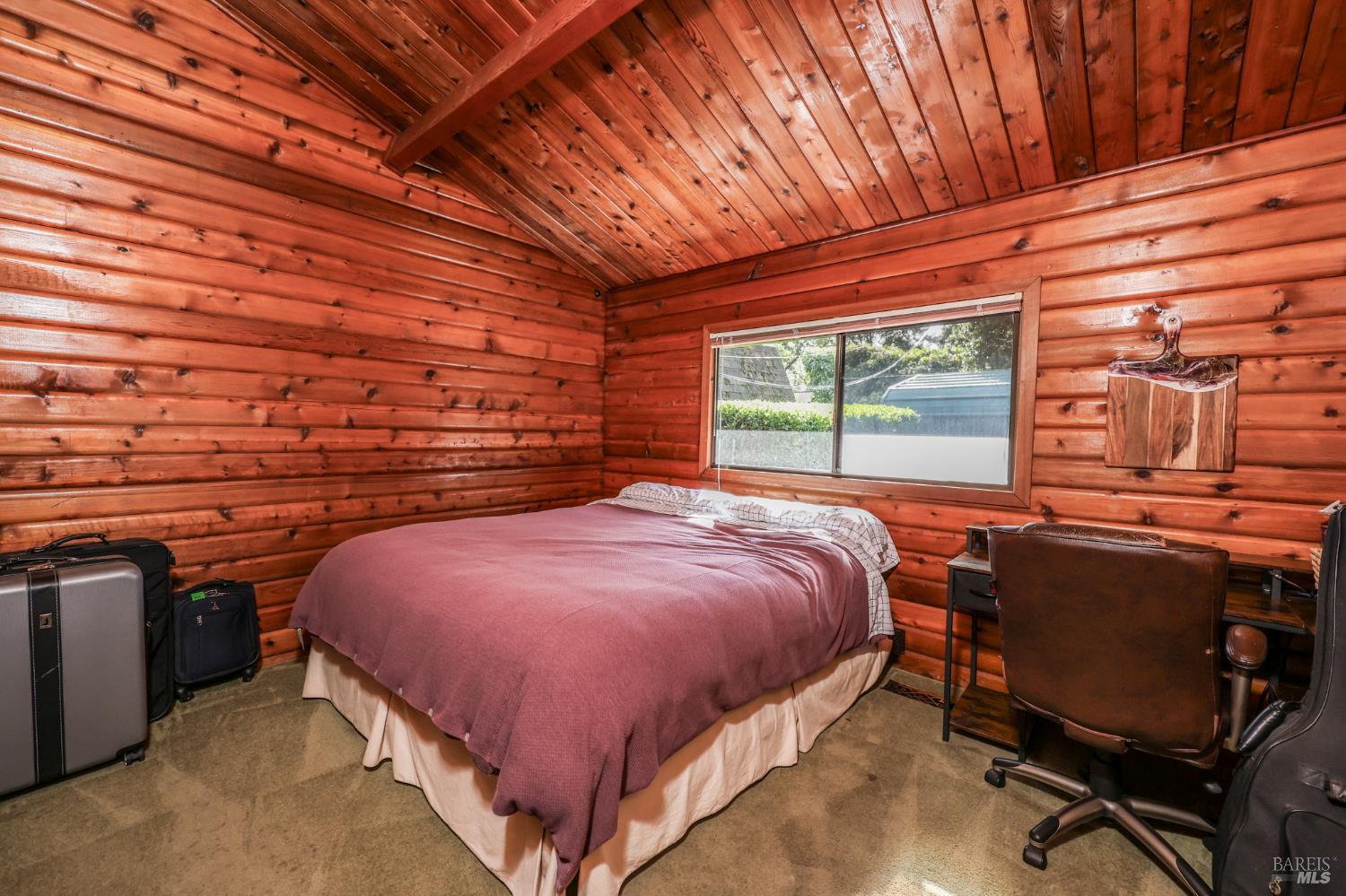11 Green Point Lane Novato, CA 94945 - Photo 13 of 24 a bedroom with a bed next to a large window