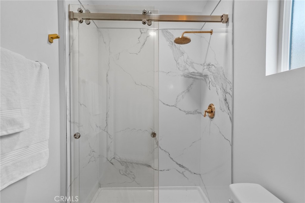 426 Jacaranda Place, Unit A Fullerton, CA 92832 - Photo 15 of 41 a bathroom with a shower and toilet