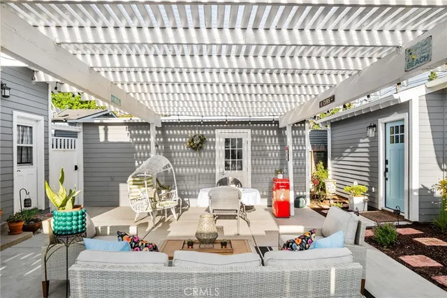 a backyard of a house with outdoor seating